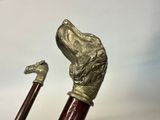 a close up of a cane with a dog head on it