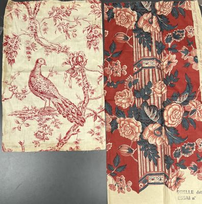 two pieces of cloth with a bird and flowers on them