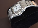 a watch that is sitting on a black display case
