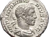 a silver coin with a bust of a man on it