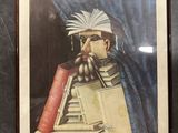 tableau représentant un homme en train de lire un livre et tenant un autre livre à la main