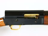 the rifle is made of wood and has a brass - plated handle
