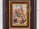 an oil painting of a river and trees in a wooden frame