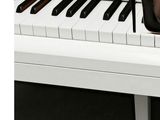 a woman ' s legs in high heels on a piano keyboard