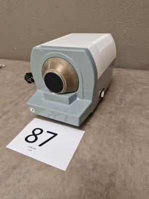 a clock that is sitting on the floor next to a number