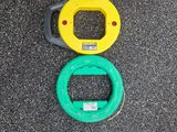a yellow and green object on the ground next to a pair of shoes