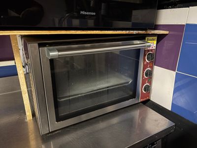 an image of a toaster oven sitting on a kitchen counter