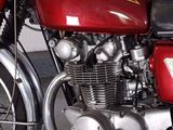 a red motorcycle that is parked in a garage