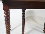 a wooden table with a marble top on it