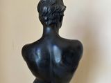 statue of a male torso on a marble base