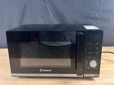 an image of a microwave oven on a wooden table