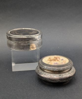 an image of a small silver box with a lid and a small silver box with a lid