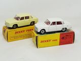 three toy cars that are sitting on top of a box