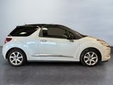 a picture of a small white car parked in a room