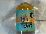 a bottle of rum sitting on a table with a price tag