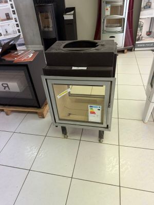 a stove in the middle of the floor in a store