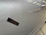 a sticker on the door of a car that is parked in a garage