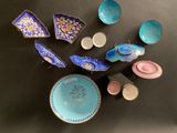 a lot of different bowls and plates on the table