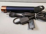 an image of a microphone and charger sitting on a table