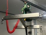 a red cord hanging from the ceiling of a kitchen