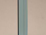 a close up of a tall glass sculpture on a table