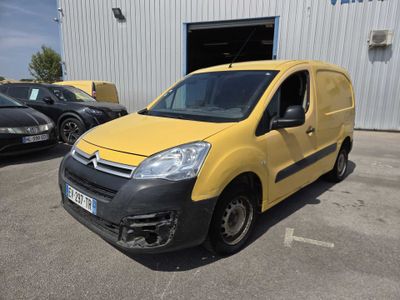 the yellow van is parked in front of a building