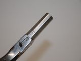 a pair of pliers that are being used to cut a piece of metal