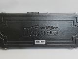 a black case with a name on it on a white surface
