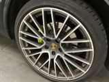 a close up of a tire on a car in a garage