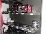 many shelves with various items on them in a store