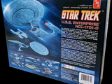 a box with a model of a star trek ship in it