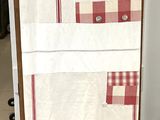 a towel rack with a towel on it in a kitchen