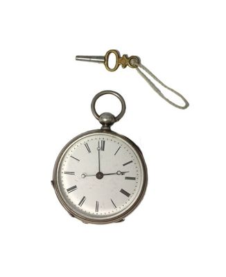 a silver pocket watch with a chain hanging from it ' s side
