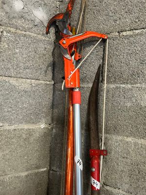 a bike that is leaning against a wall with a red handle