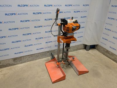 an image of a drill on a stand in front of a wall