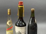 three bottles of wine sitting next to each other on a table