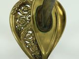 a close up of a metal object with a knife in it