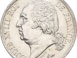 an old silver coin with a portrait of a man on it