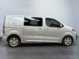 the silver van is parked on the concrete floor in the room
