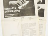 two pages of a newspaper with a picture of two hands playing a piano