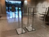a glass display case in the middle of a room