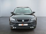 the front view of a grey car in a white room