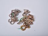 two pairs of scissors on a white surface