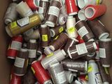 a cardboard box full of different colored spools