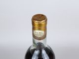 bottles of liquor are lined up on a table with a white background