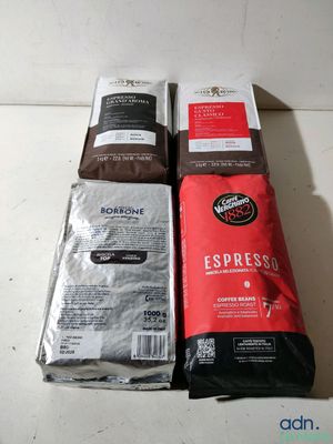 three bags of coffee sitting on top of a counter next to each other