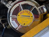 a close up of a fire hydrant with a yellow label