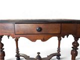 a small wooden table with a drawer on top of it