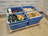 two blue bins with tools in them sitting on a pallet