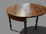 an image of a wooden table with two leaves on top of it